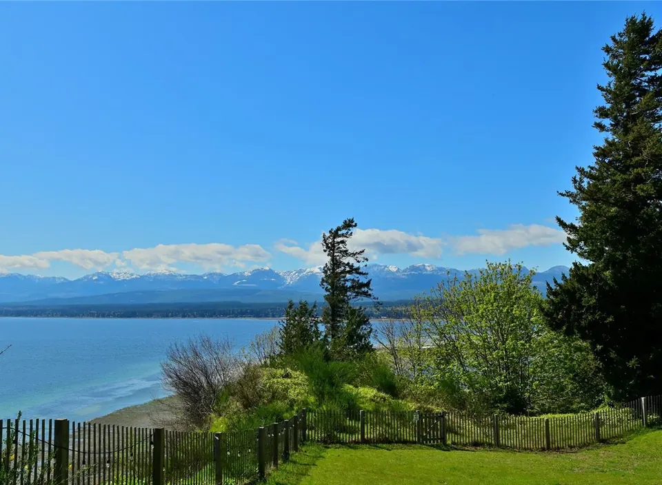Ocean, shoreline and distant mountains viewed from the Filberg House property.
