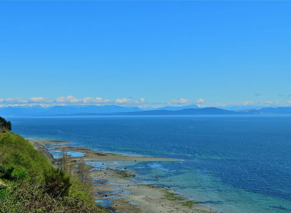 Coastal water and distant mountain range viewed from the Filberg House property.